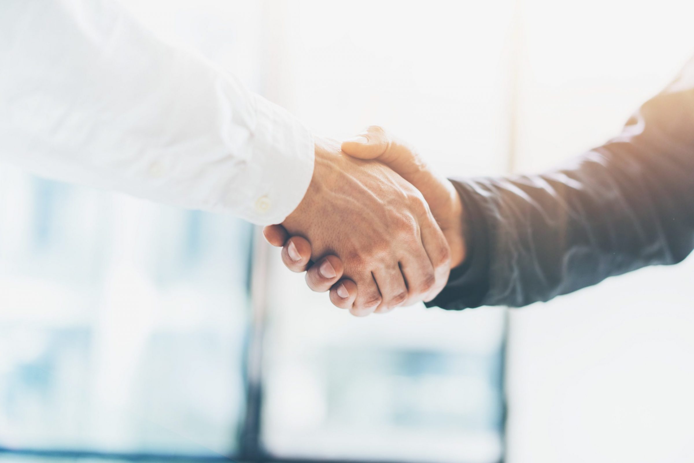 Photo of two people shaking hands